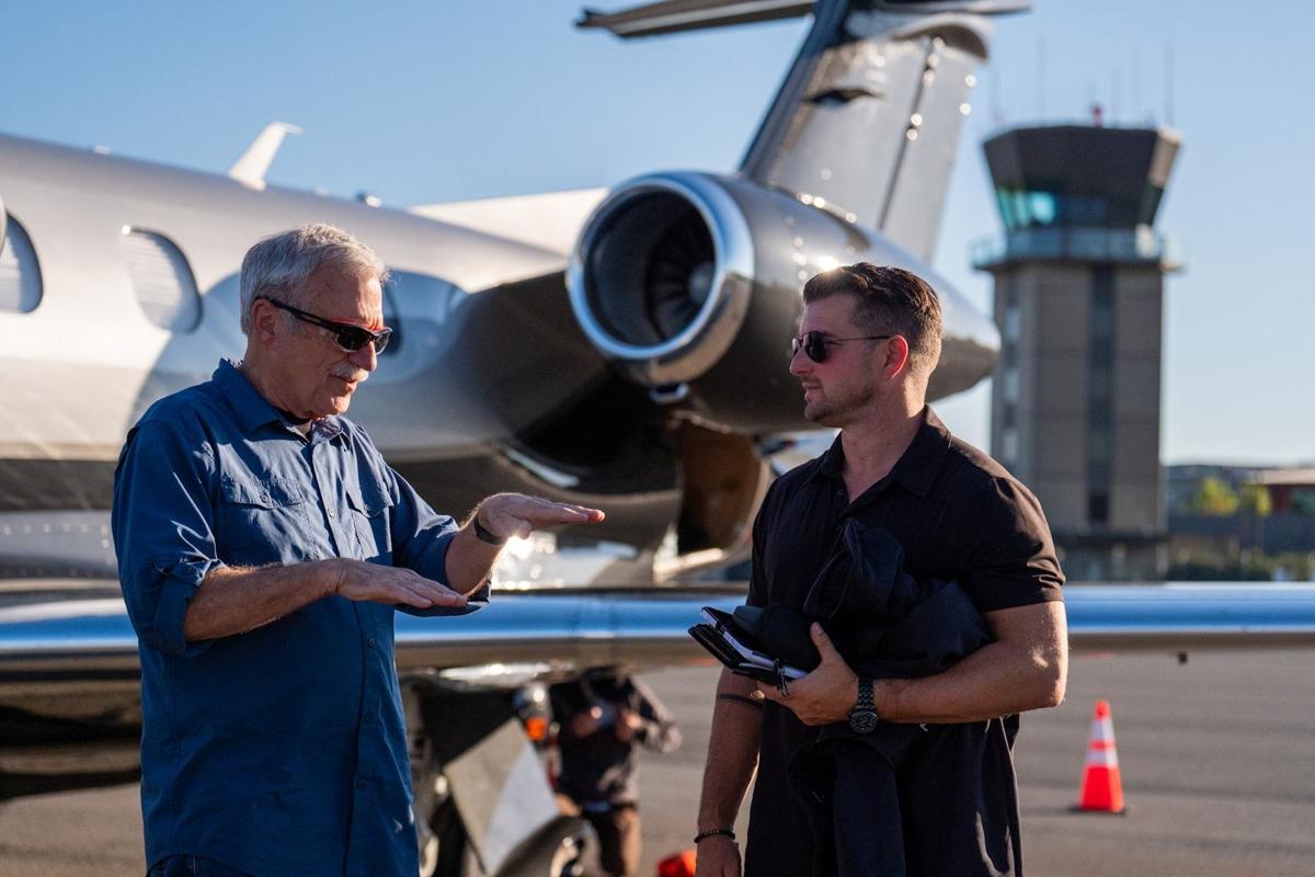 Kevin LaRosa II in a briefing beside a private jet