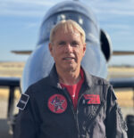 Randy Howell in a flight suit in front of an L-39 jet